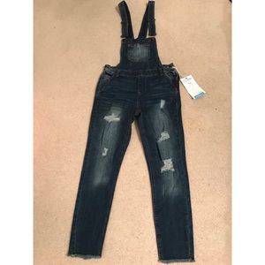 Never worn before stylish ripped denim overalls.